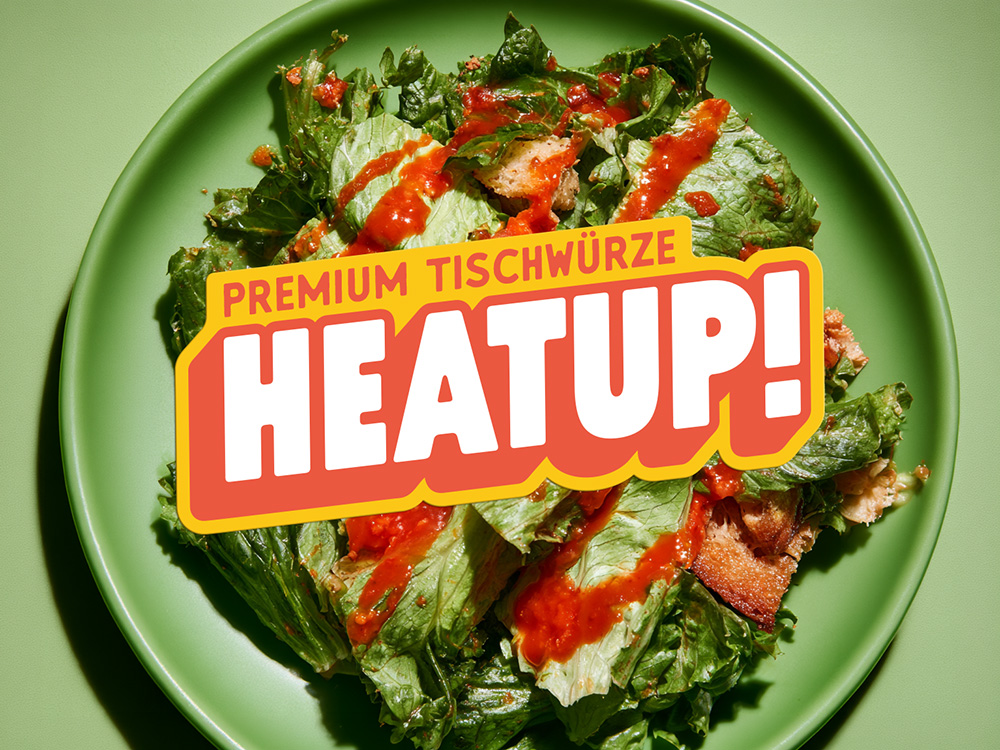 HeatUp hot sauce logo on a salad dish by SLAP Design Studio